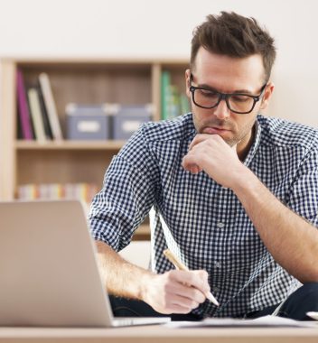 Portrait of focus man working at home